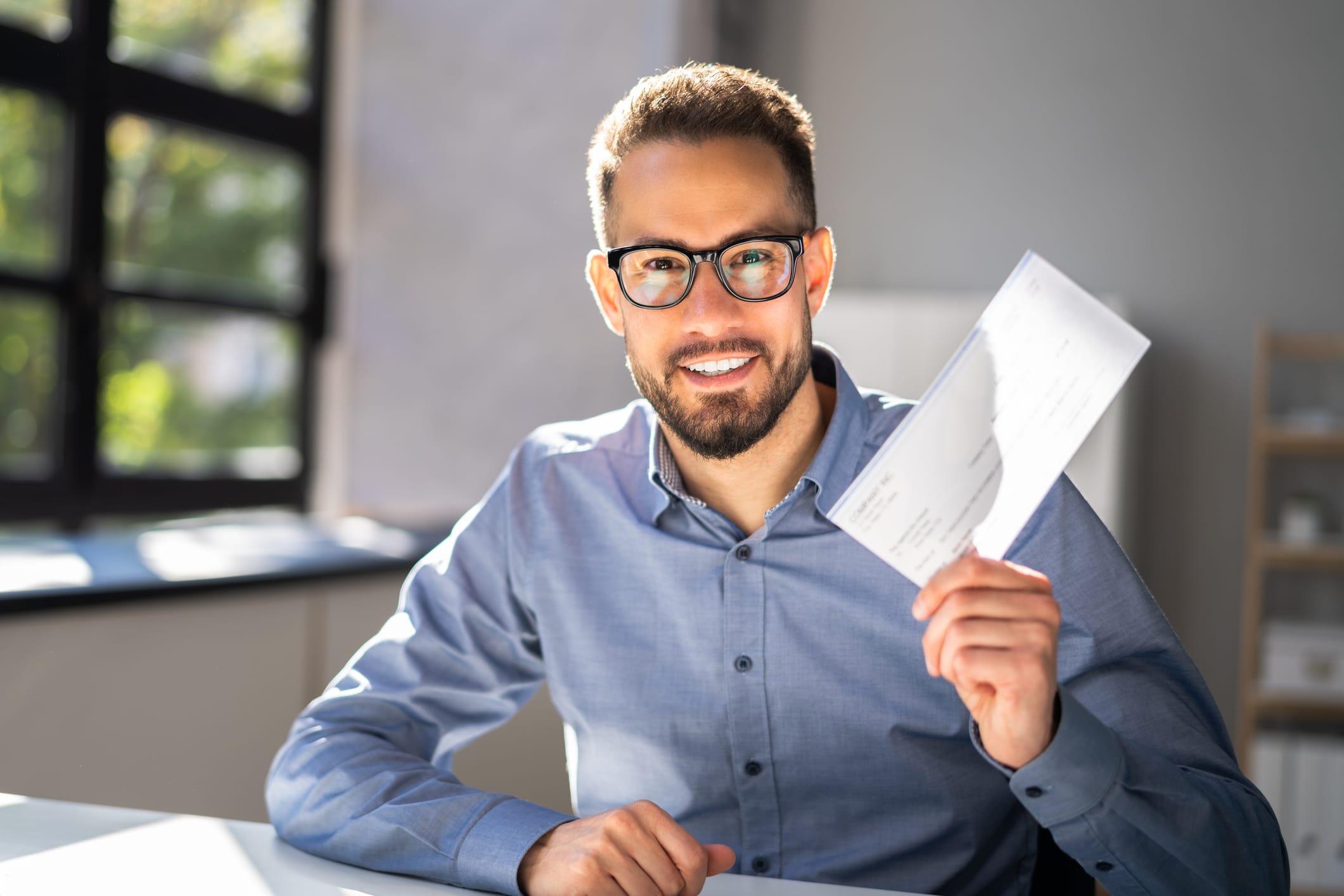 A lawyer producing a check